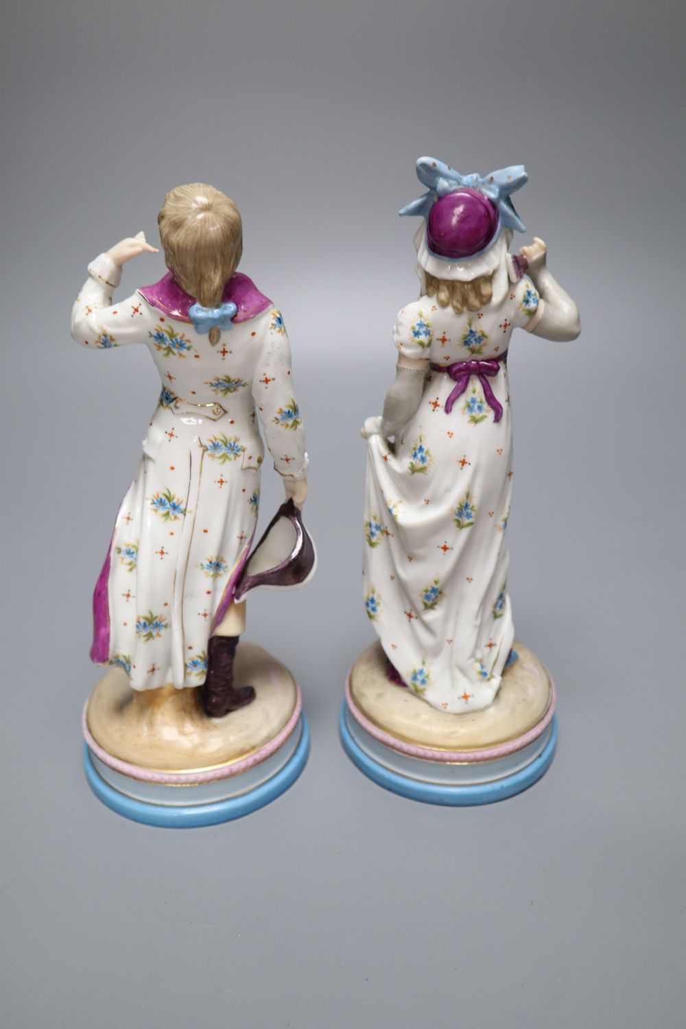 A pair of KPM Berlin porcelain figures of a maiden and a gallant, height 22cm